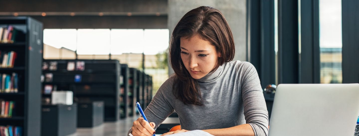 Student studying inside concentrating